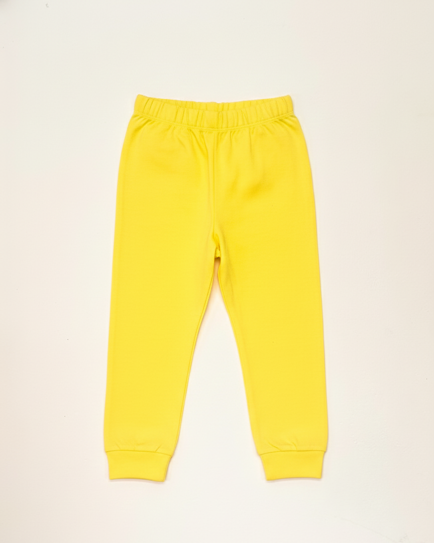 Yellow sweatpants on a beige background