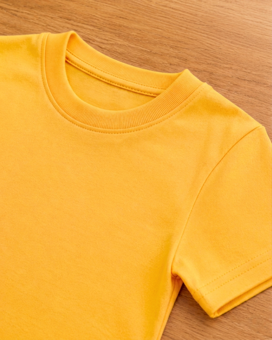 Yellow t shirt on a beige background