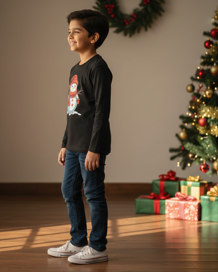 Young boy standing in a room with a Christmas tree and presents.