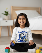 Young girl sitting on the floor with colorful blocks, wearing a shirt with a dog graphic and text.
