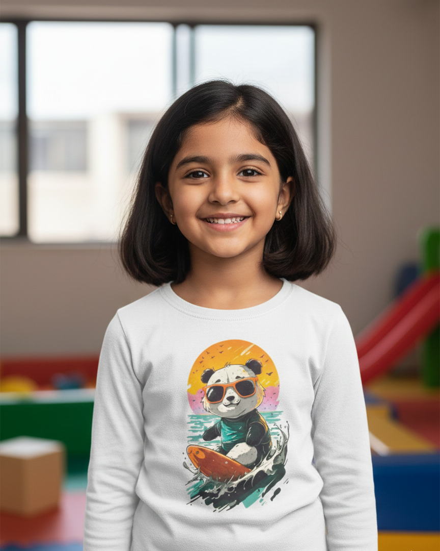 Young girl wearing a white long-sleeve shirt with a panda design in an indoor setting