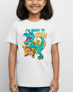 Young girl wearing a white t-shirt with a colorful dinosaur graphic and text.