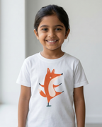 Young girl wearing a white t-shirt with a fox graphic on a plain background